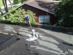 Removal of old roofing shingles at this TX home