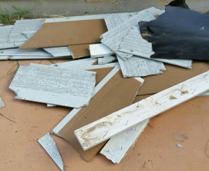 pieces of broken fiber cement siding